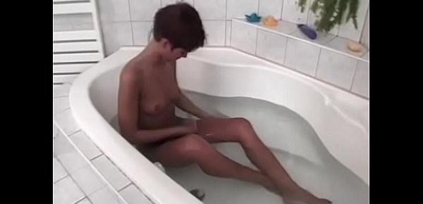  Lusty bitch satisfies her wet cunt in bath tub